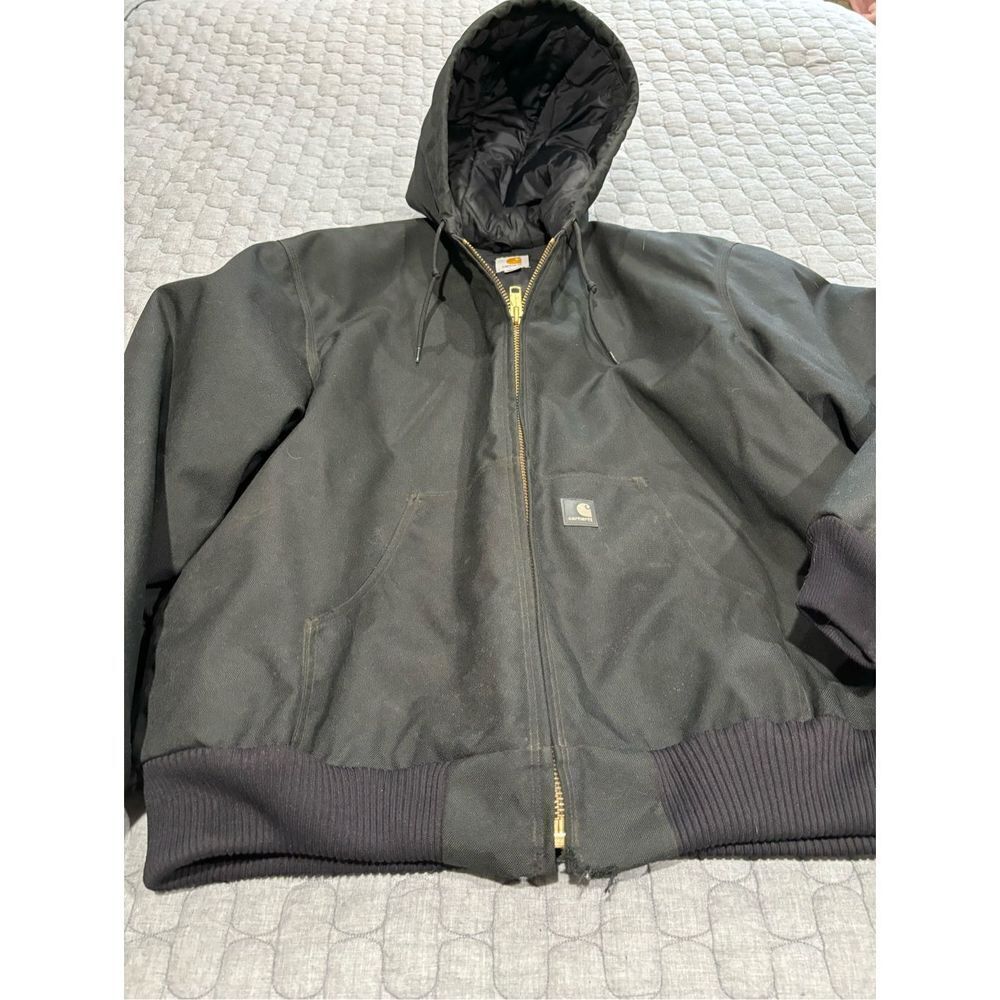 Men’s black Carhartt hooded coat and bib overalls.  Size XL/38/32